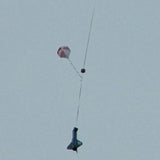 a person flying a kite in the air 